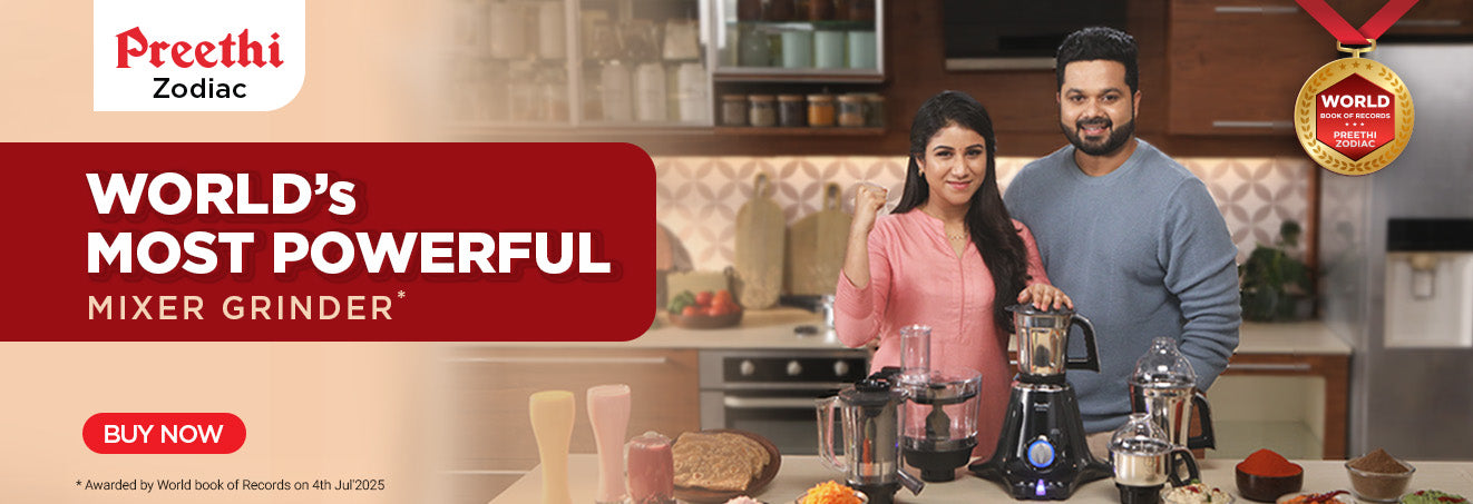 Advertisement for Preeti Zodiac mixer grinder with a couple in a kitchen setting.