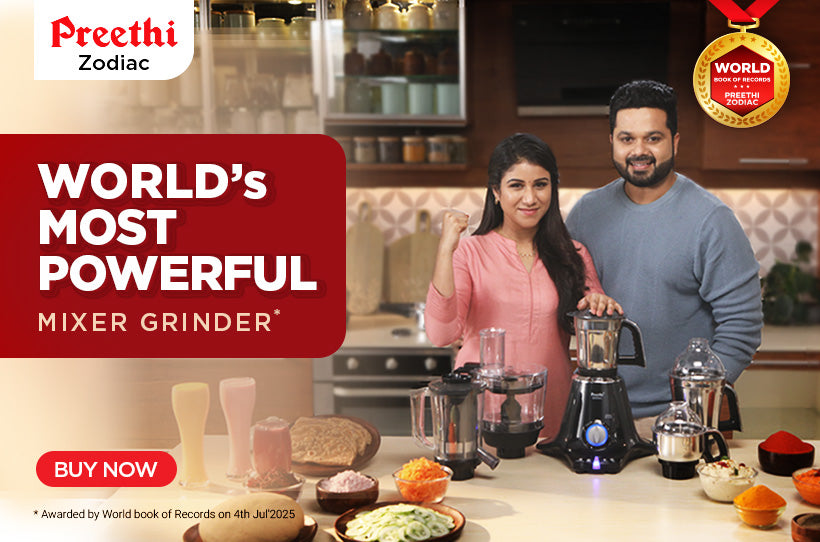 Advertisement for Preeti Zodiac mixer grinder with a couple in a kitchen setting.