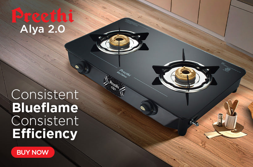 Preethi Alya 2.0 gas stove on a kitchen counter with branding and product features highlighted.